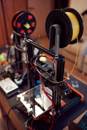 Plastic coil on 3D printer in studio