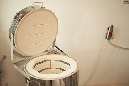 Electric kiln near wall in pottery