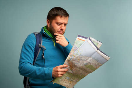 tourist with a card in his handsの写真素材