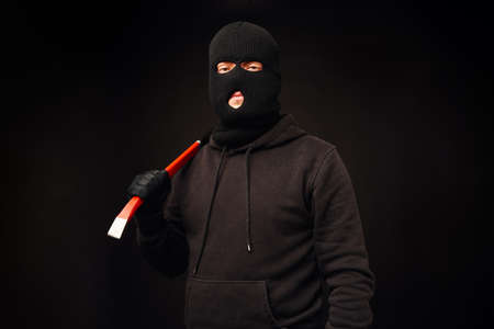 Portrait of burglair with crowbarの写真素材