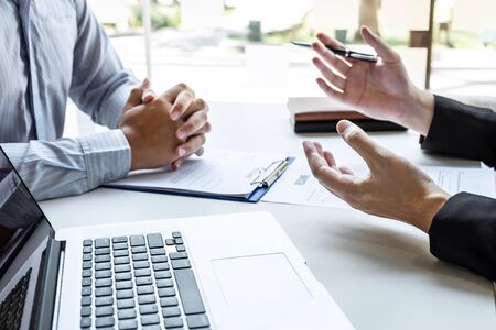 Business interview consider and asking candidate questions a resume conversation during about profile of candidate, conducting a job interview listen to answers to thought.の写真素材