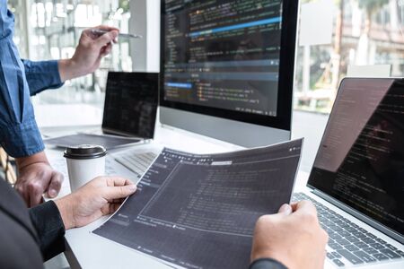 Team of developer programmer working on project in software development computer in IT company...