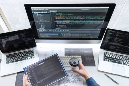 Developer programmer working on project in software development computer in IT company office,...