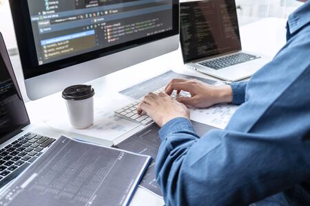 Developer programmer working on project in software development computer in IT company office,...