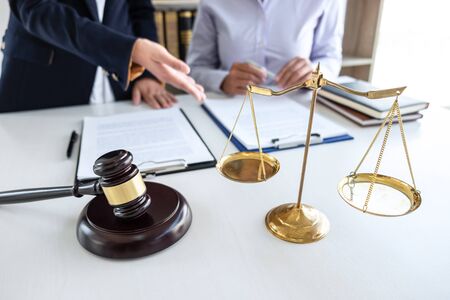 Professional female lawyer or counselor discussing negotiation legal case with client meeting with document contract in office, law and justice, attorney, lawsuit concept.の写真素材
