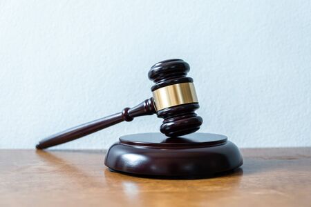 Image of gavel for lawyer courtroom on the desk.