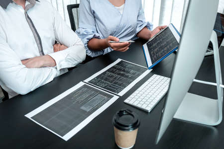 Team of Programmer working in software javascript computer in IT office, Writing codes and data code...