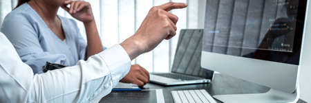 Team of Developer programmer working on coding program software computer in office, Writing website...