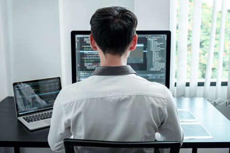 Developer programmer working on coding program software computer in office, Writing website and...