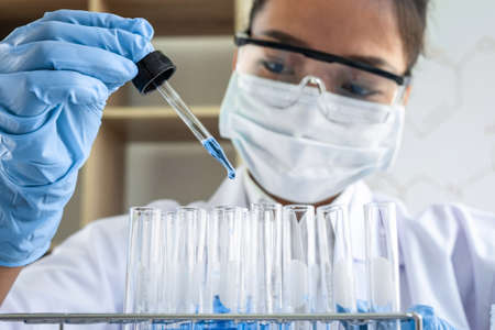 Female scientific researcher or doctor working in laboratory about virus and vaccine antiretroviral...