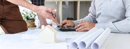 Team of architects or engineering consulting and analyzing working on objects tools and construction...