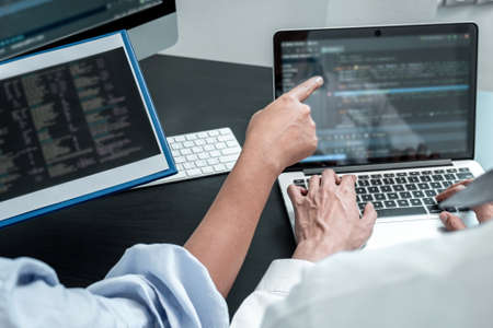 Team of Programmer working in software javascript computer in IT office, Writing codes and data code...