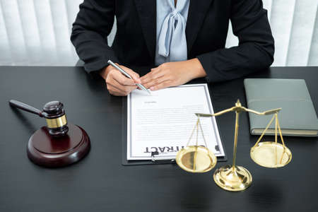Female lawyer working with legal case document contract in office, law and justice, attorney,...