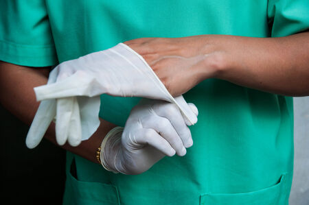 Wearing glovesの写真素材