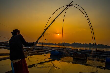 Silhouette of fishing in the river