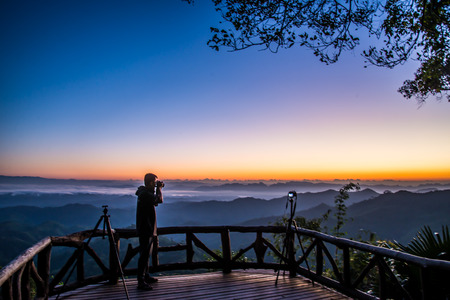 Photographer at the mountainの写真素材