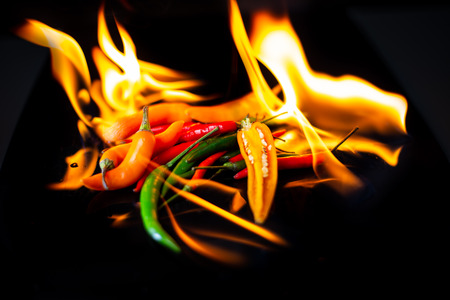 Burning chili on black backgroundの写真素材