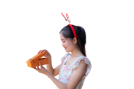 Beautiful girl happy with box gift on white backgroundの写真素材