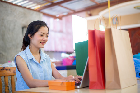 Beautiful girl happy with owner businessの写真素材