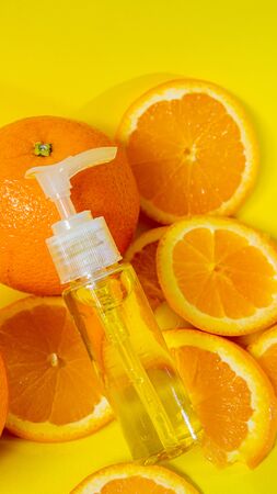 Perfume bottle place on orange fruitの写真素材
