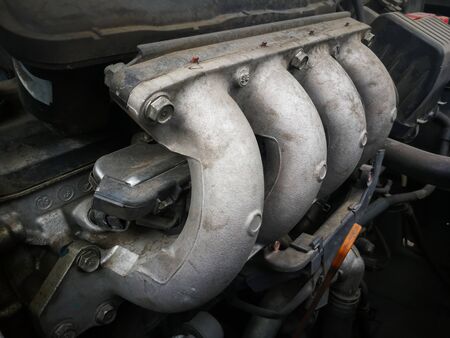 Part of dirty car engine 4 injectors