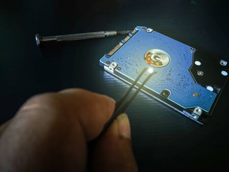 The concept of computer hardware upgrade and technology. Repairing and upgrade SSD (Solid State...