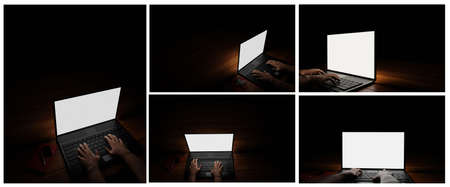 The hand of a person using a notebook or laptop, a blank screen, white, dark background, blacklight...