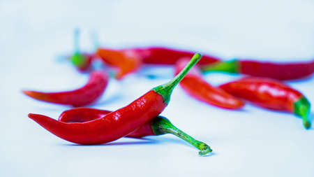 Red hot chilli peppers on white background. Close up. A backdrop of Red hot chilli peppers.