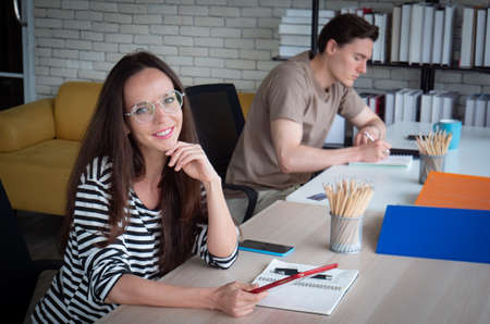 Work from home concept or home office, the white Caucasian woman wearing glasses, looking at the...