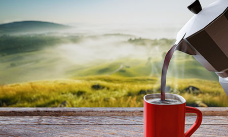 Pour fresh coffee from the Mocha pot into the red coffee mug. There is smoke rising from the hot coffee. Red glasses on a wooden table top. The background is mountain scenery. The morning sun, there is a thin mist above the ground. 3D Renderingの写真素材