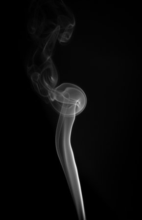 White smoke in a black background. smoke white lightの写真素材