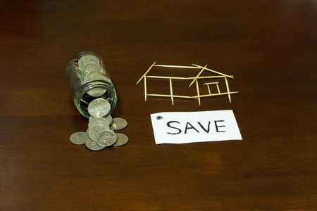 Coins and picture house from Toothpickの写真素材