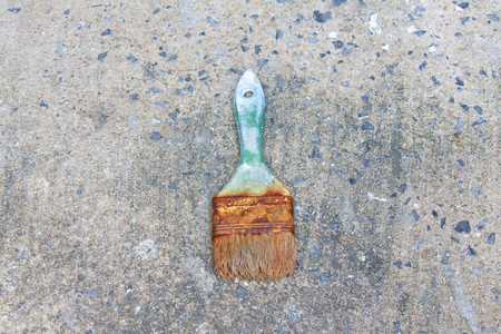 Used paint brushes with size 63mm.(2-1/2 in) on dirty floorの写真素材