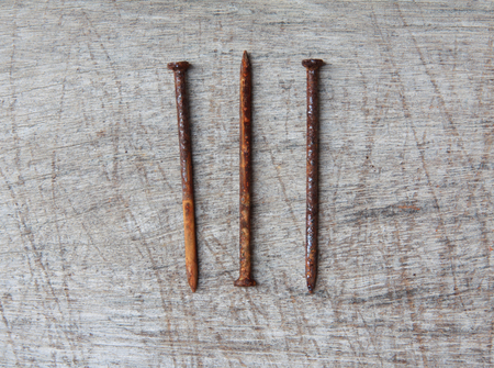 The old nail with rust on slatの写真素材