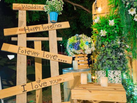 wedding,love,happy on wood and green leaf backgroundの写真素材