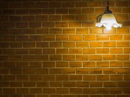 brickwork wall with ceiling lampsの写真素材