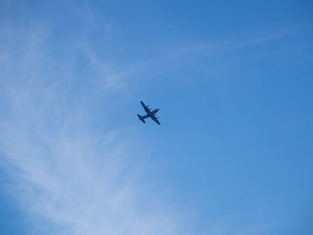 plane on blue sky and cloudsの写真素材