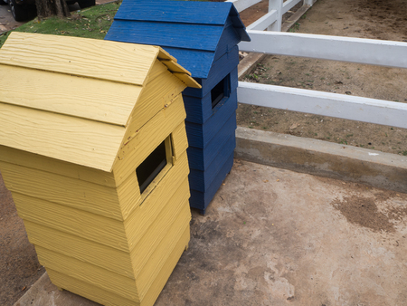 yellow and blue bin in parkの写真素材