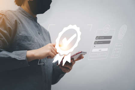 Casual woman working with sign of the top service Quality assurance, Guarantee, Standards, ISO certification and standardization concept. Business woman with Quality assurance of business servicesの写真素材