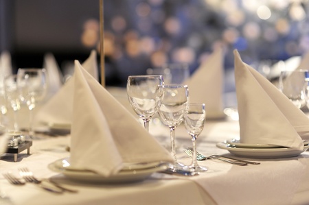 Glasses and plates on table in restaurant