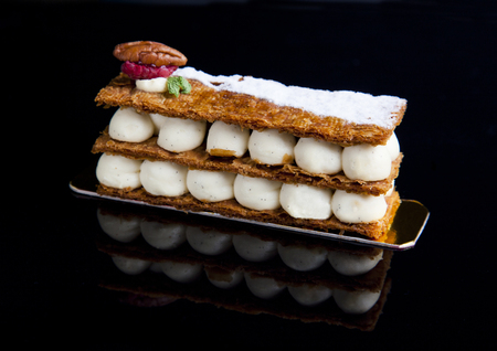 Luxury beautiful chocolate ice cream cake on a black background