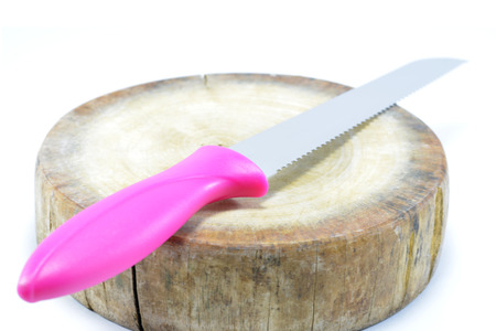 Pink sword or Knife oblique on the chopping block - White background