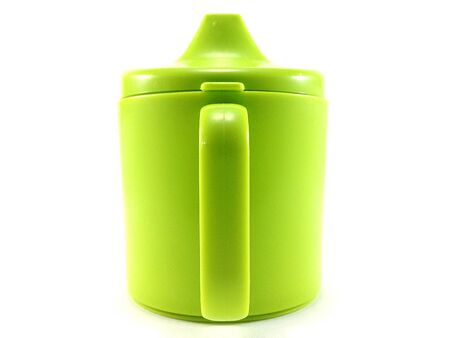 green plastic cup on white backgroundの写真素材