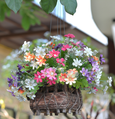 Rose, artificial flowers bouquet in the jardiniere - select focus on Rose, artificial flowersの写真素材