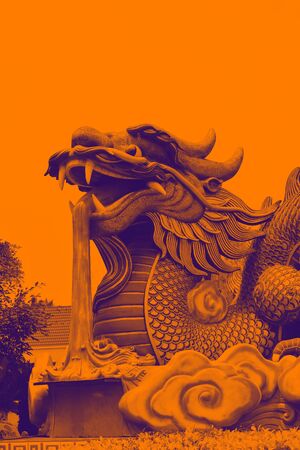 Dragon Statue with red color backgroundの写真素材