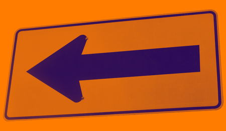 The black arrow sign obliquely on red background