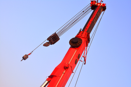 Red crane on blue sky backgroundの写真素材