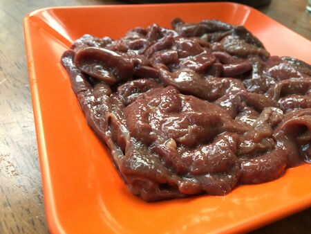 Pig liver on the dishの写真素材