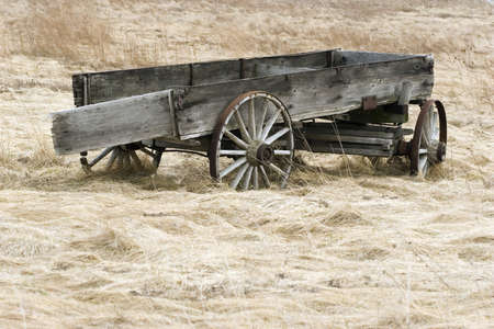 Abandoned wagon in fieldの写真素材
