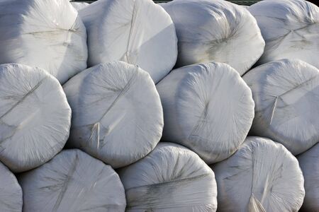 Stack of wrapped haybalesの写真素材